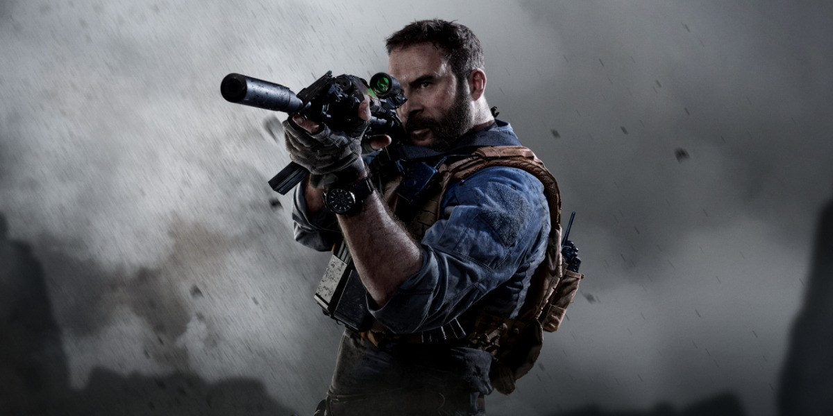 In a still from the game Call of Duty Modern Warfare, a many holds a large gun up in his sights against a smoky background