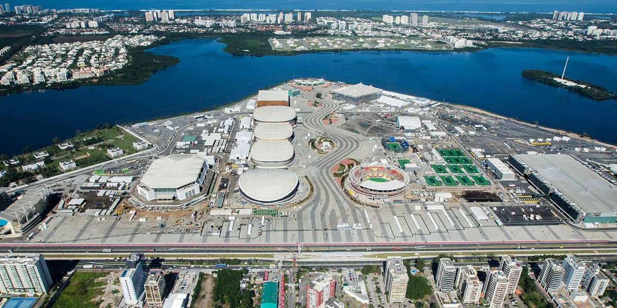 A city scape from the sky shows the huge Rio Olympic park against the sprawl of the city