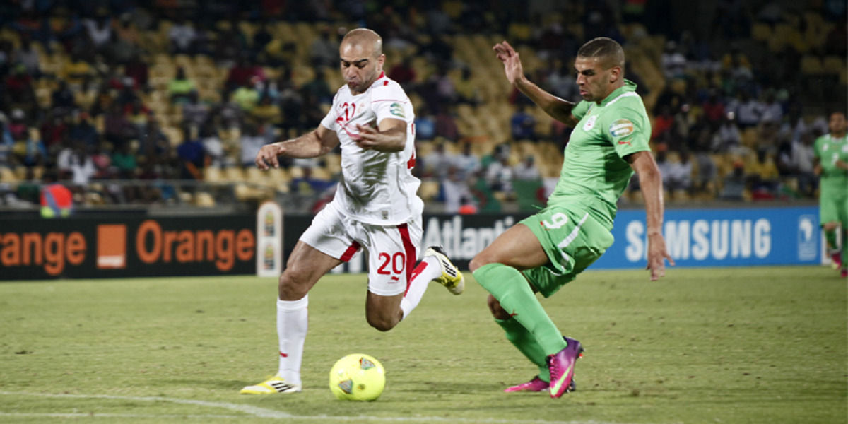 Algeria's Islam Slimani challenges for the ball at AFCON 2013