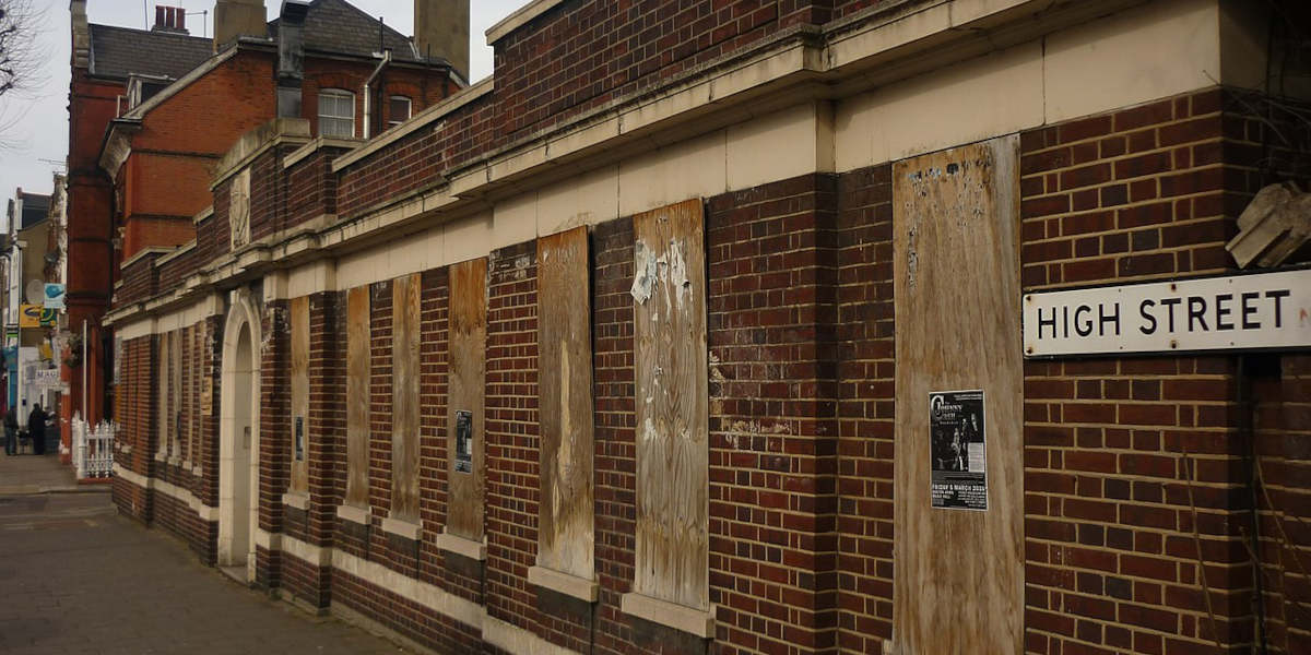 A former public baths and wash house in London now boarded up and abandoned