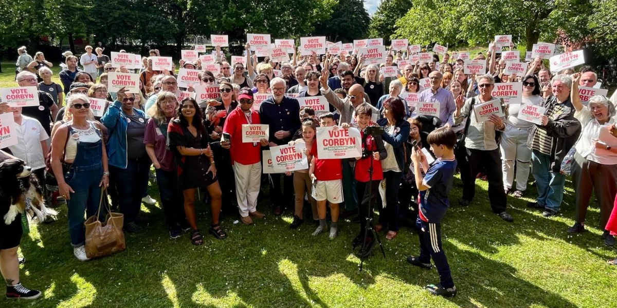 Jeremy Corbyn stands surrounded by supporters as he campaigns for reelection in Islington North