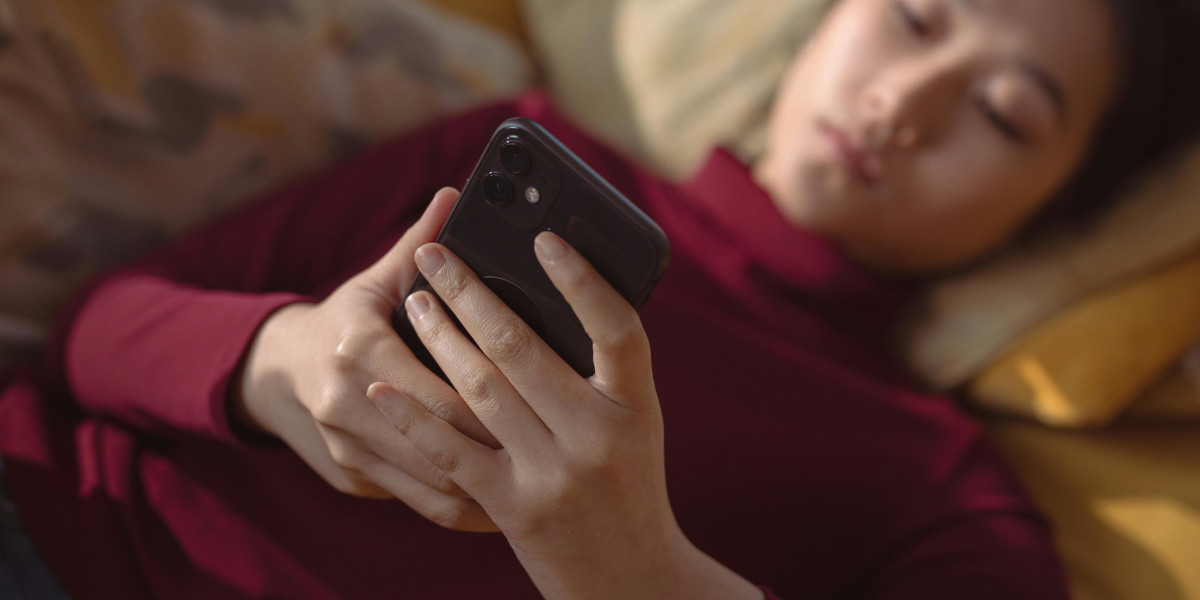 Teen girl holding mobile phone